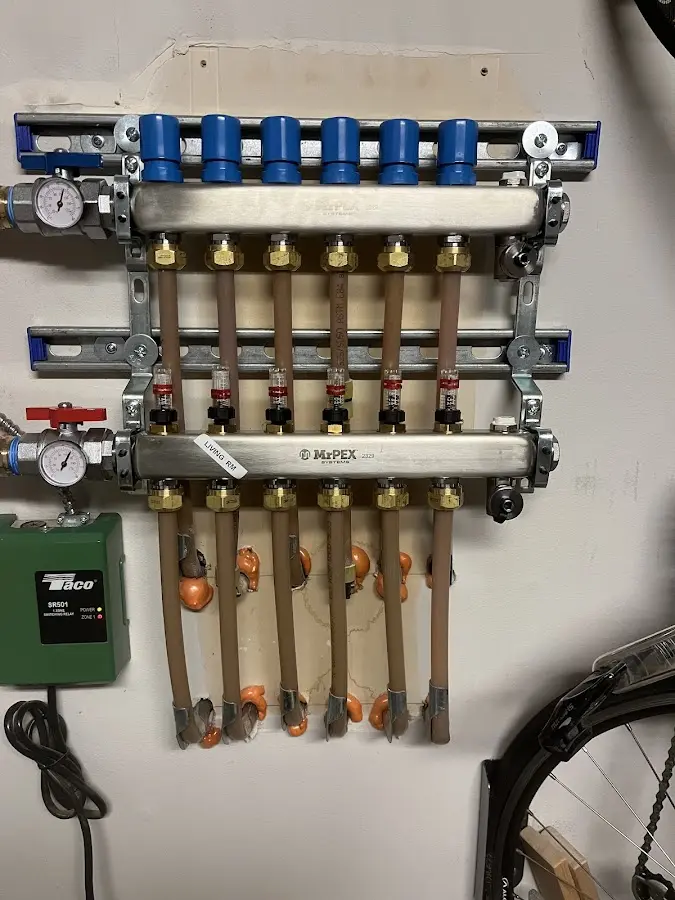 Plumber performing Water Heater Repair at a residential property in Plymouth